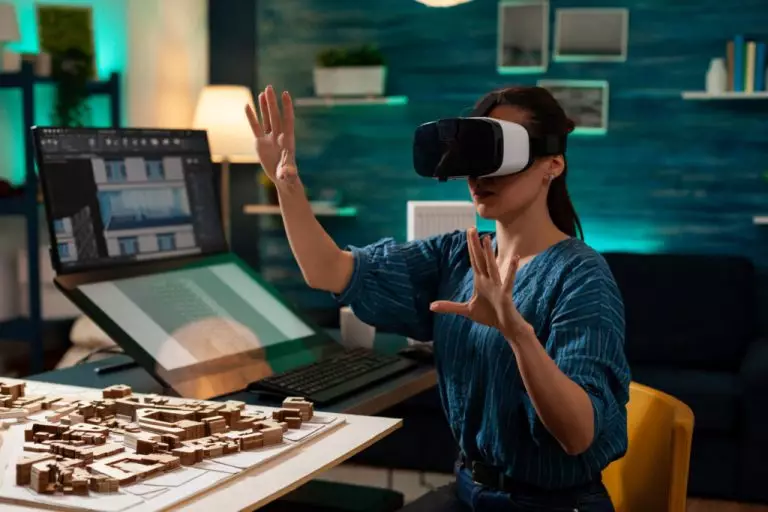 A woman with a  VR headset viewing interior design of a house through technology